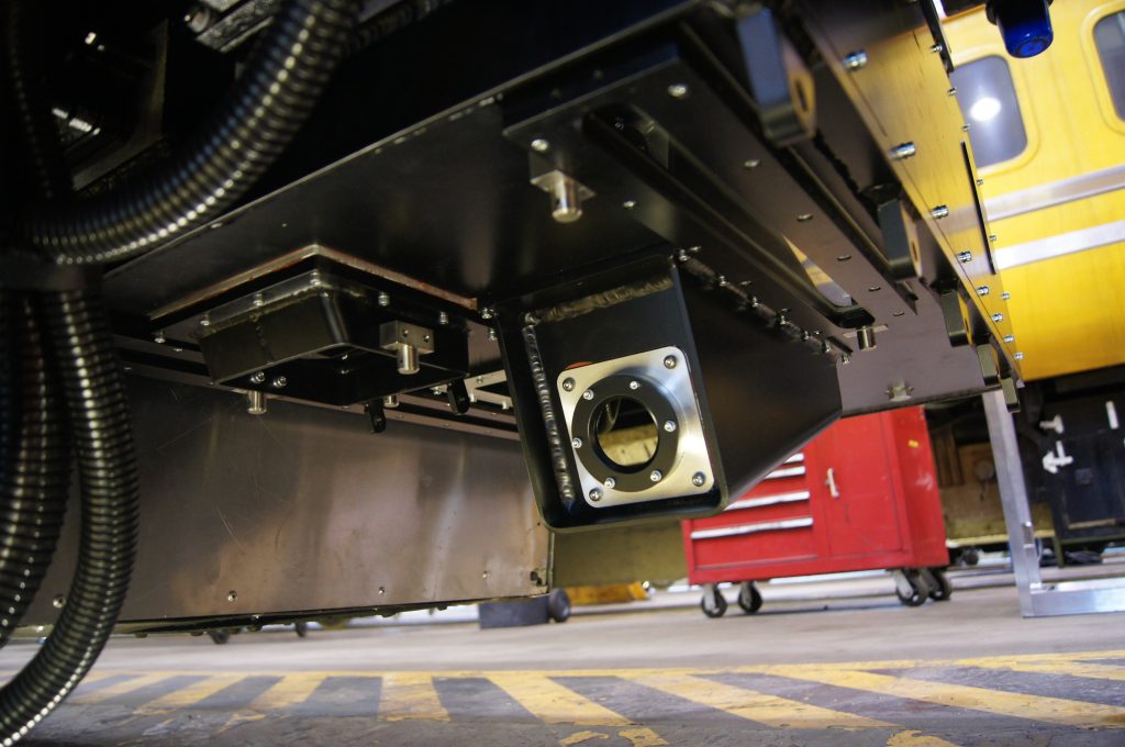 Attached to the front of the train, a camera moves along rail tracks in need of inspection.